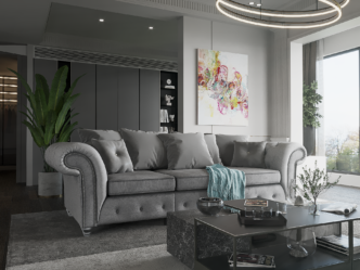 A greyi velvet Buxton 3 seater sofa in a living room with a painting on the wall and a coffee table in front of the sofa. The sofa is similar in shape to a traditional Chesterfield sofa, with curving lines to the arms, but has square cushions at the back.